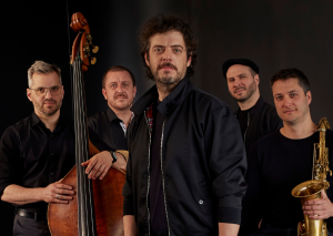 The five musicians of Quiet Quintet posing with their instruments, including double bass and saxophone